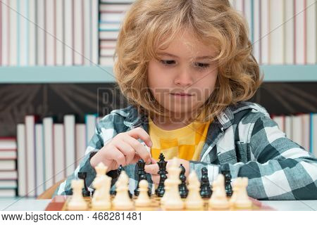 Little Chess Player. Chess School. Child Think About Chess Game. Intelligent, Smart And Clever Schoo
