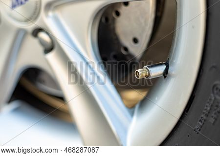 Air Valve In A Car Tyre Close-up