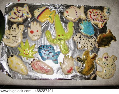 Halloween Cookies, Frosted Cookie Cutter Cookies On Foil