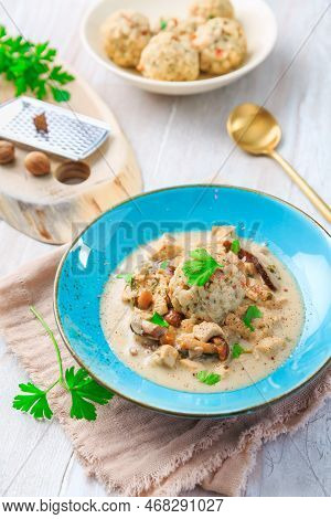 Homemade Bavarian Bread Dumpling, Called In South Germany As Semmelknoedel With Creamed Mushroom Sau