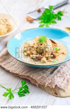 Homemade Bavarian Bread Dumpling, Called In South Germany As Semmelknoedel With Creamed Mushroom Sau