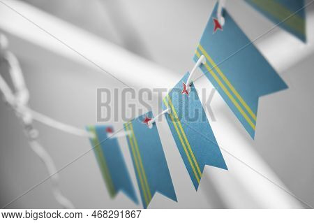 A Garland Of Aruba National Flags On An Abstract Blurred Background
