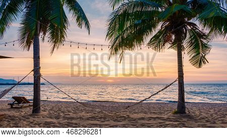 Sunset At The Beach With Palm Trees At Na Jomtien Pattaya Thailand, Tropical Beach During Sunset