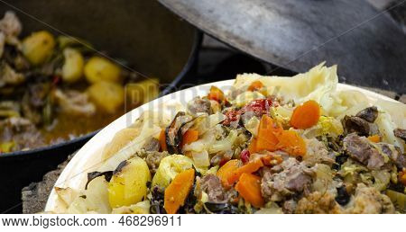 Dimlama On A Platter. Uzbek Cuisine. Vegetables Cooked In Their Own Juice In A Cauldron Over A Fire.
