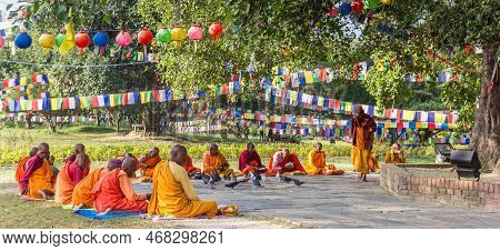Lumbini, Nepal - November 09, 2019: Panorama Of Monks In Colorful Clothing In The Park Of The Mayade