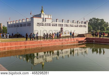 Lumbini, Nepal - November 09, 2019: Mayadevi Temple With Reflection In The Water In Lumbini, Nepal