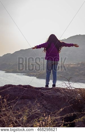 Isolated Young Girl At Mountain Top With Lake View Backbit Shot From Flat Angle