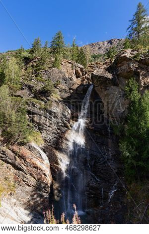 Steep Slope With Flowing Alpine Lillaz Waterfall (cascate Di Lillaz) In Granite Crevice And Slender 
