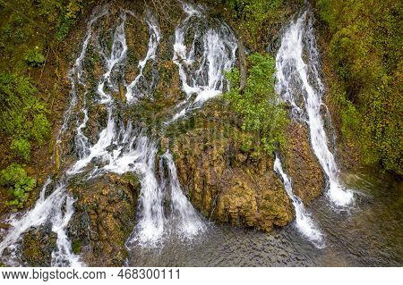 Waterfall In Nature. Mountain Cascade River Waterfall. Aerial Drone View
