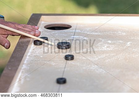 Men Playing Novuss Game. Novuss Is A National Sport In Latvia Similar To Pocket Billiards Or Pool.