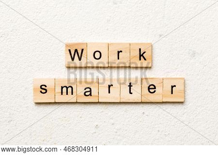 Work Smarter Word Written On Wood Block. Work Smarter Text On Table, Concept.
