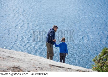 Happy Family. Father Playing With Son  Oudoors. Positive Human Emotions, Feelings, Joy On The Lake  