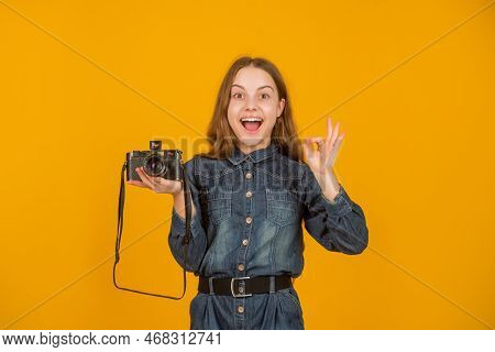 Happy Teenager Showing Ok Ring Gesture Holding Photo Camera Yellow Background, Photographer