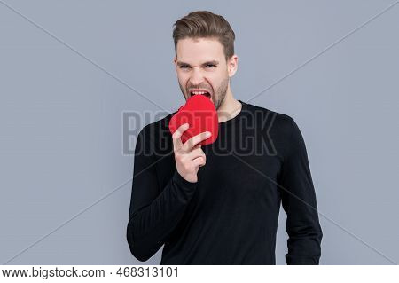 Valentines Day And Love. Heart Love Present Of Man For Valentines Day. Man Bite Love Heart Present