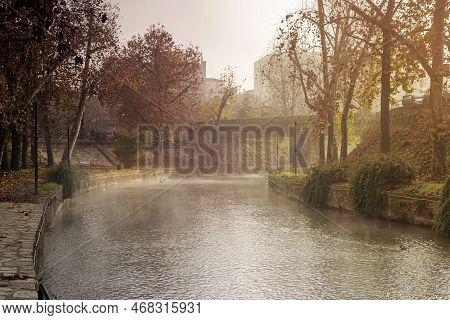 View Of The City Of Trikala, Recreation Area, Bridge And The Embankment Of The Historical Litheos Ri