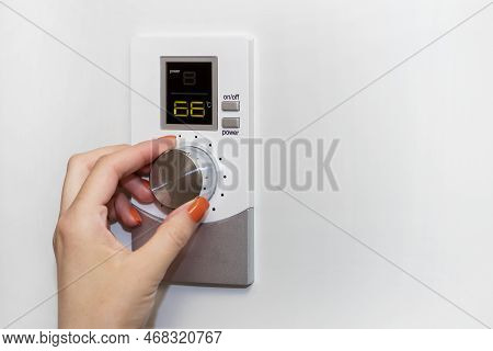 Gas Boiler. A Woman Regulates The Temperature With A Temperature Controller. Setting The Room Temper