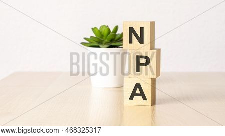 Npa - Non Performing Assets - Acronym On Wooden Cubes On Wooden Backround. Business Concept
