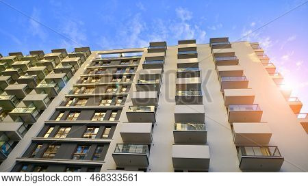 The Narrow Passage Between Modern Residential Buildings. Walls Of High-rise Apartment Buildings And 