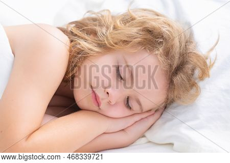 Kid Sleeping In Cozy White Bed. Child Sleeping On Bed. Bedtime, Kids Sleeps. Kid Asleep On Pillow, H