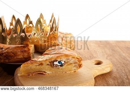 King Cake Or Galette Des Rois In French. Epiphany Pie With Golden Paper Crown And Little Ceramic Fig