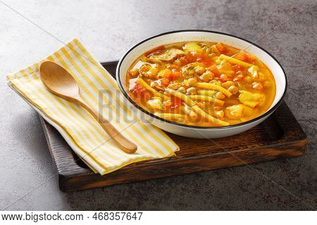 Vegetable Soup With Meat, Pasta And Chickpeas Close-up In A Plate On The Table. Horizontal