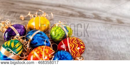 Easter Eggs On Wooden Background With Bright Tones.
