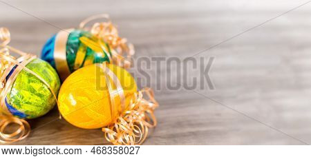 Easter Background. Colorful Painted Eggs O Wood Table.