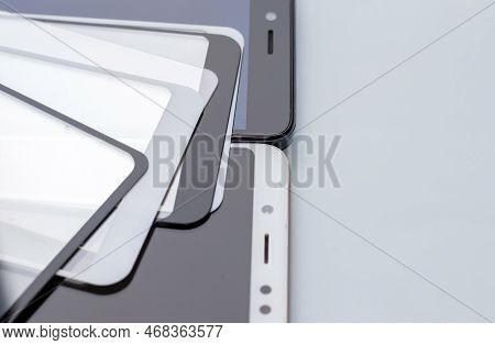 Maintenance And Repairing Smartphones. Many Tempered Glass Screen Protector