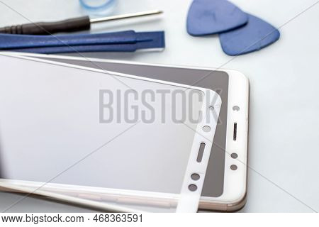 Maintenance And Repairing Smartphones. Many Tempered Glass Screen Protector