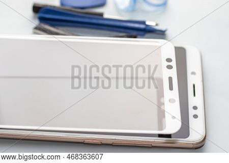 Maintenance And Repairing Smartphones. Many Tempered Glass Screen Protector And Mobile Phone, Replac