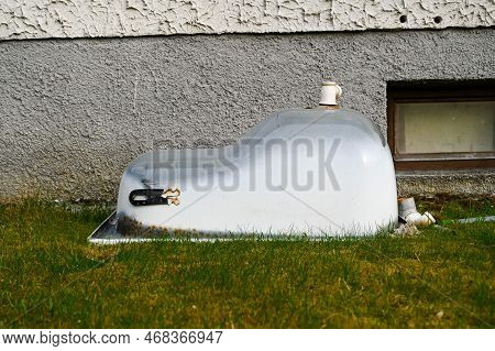 An Asymmetrical Old Bathtub With A Seat Removed During The Renovation, Removed From The Front Of The