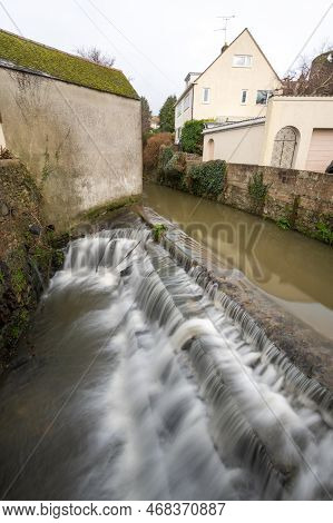 Long Exposure Of A Watefall On The River Lim Walkway At Lyme Regis In Dorset.