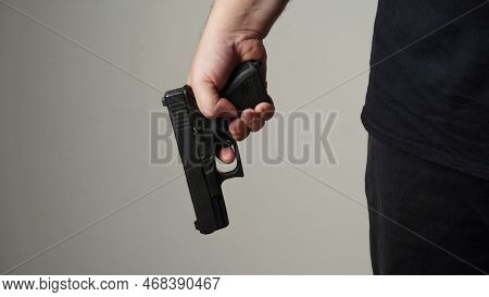 Handgun In Gunman Hand. A Man Ready To Protect Himself From Bad People