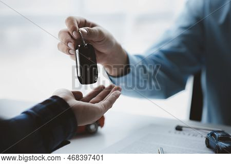 A Car Rental Company Employee Pointed Out The Renter To Sign The Rental Agreement After Discussing T