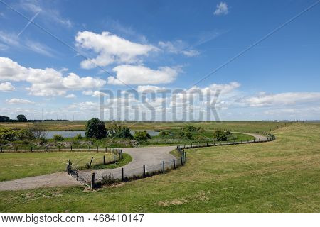 Country Road Along The Dike In Dutch Province Groningen Near Punt Van Reide