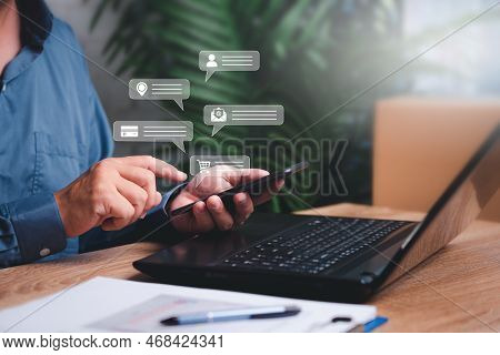 Businessman Use Smartphones To Chat With Customers On Virtual Screen About Parcel Delivery Service A