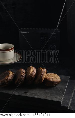 Apang Bale Cake Or Apang Bakar, And A Cup Of Tea Isolated On Black Background. Indonesian Cake