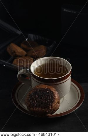Apang Bale Cake Or Apang Bakar, And A Cup Of Tea Isolated On Black Background. Indonesian Cake
