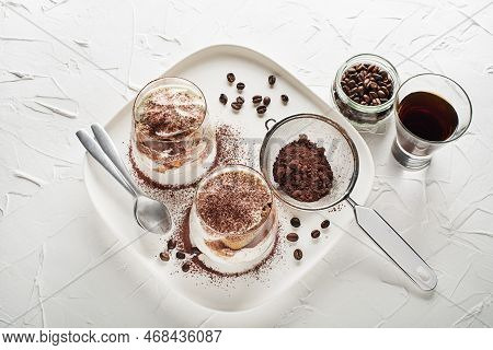 Traditional Italian Dessert Tiramisu In A Glass Cup. Homemade Tiramisu In Glass Jars, Step By Step C