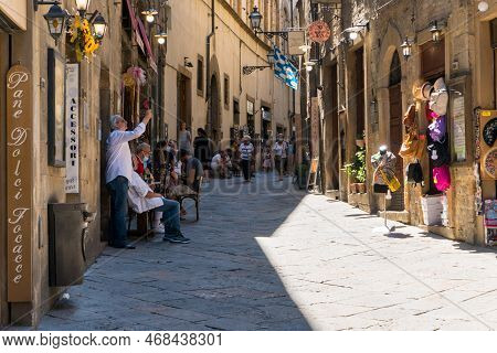Volterra,italy-august 8,2020:people Strolling In Volterra During A Sunny Day.