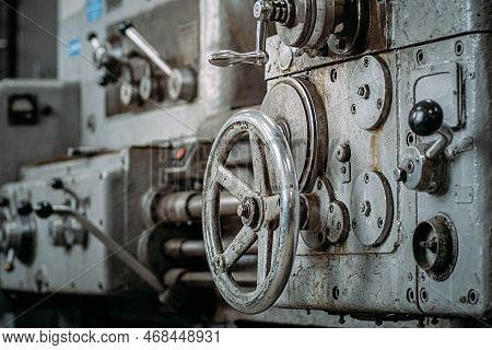Old Lathe For Metal Processing. Type Of Metal Machine Parts In Lathe Shop At Factory. Industrial Bac