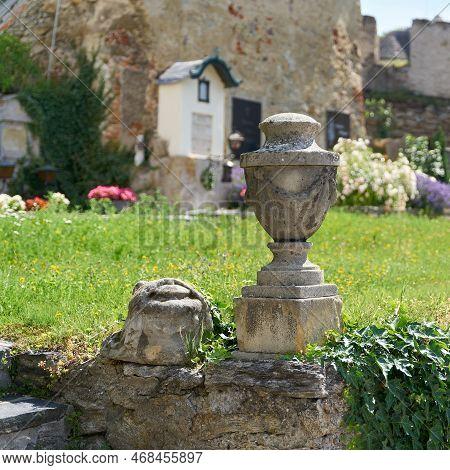 Old Historical Urn On The Cemetery Of The Small Town Duernstein In The Wachau In Austria