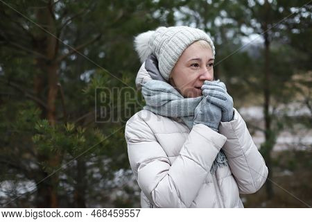 Portrait Of Beautiful Happy Senior Retired Elderly Woman Is Freezing Walking Outdoors In Winter Snow