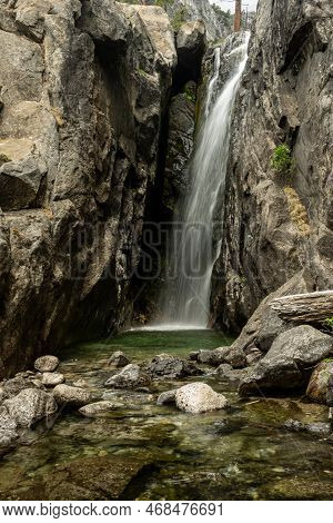 Register Creek Falls Off Of Cliff Into Pool Below In Yosemite