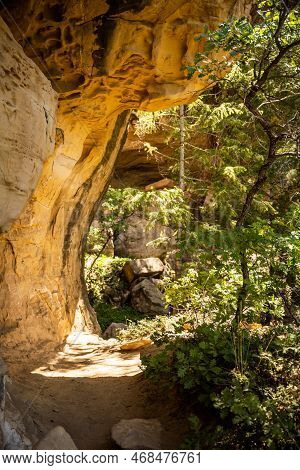 Rock Ledge Hangs Over Petroglyph Trail In Mesa Verde National Park