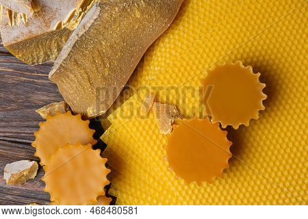 Different Natural Beeswax Blocks And Sheets On Wooden Table, Flat Lay