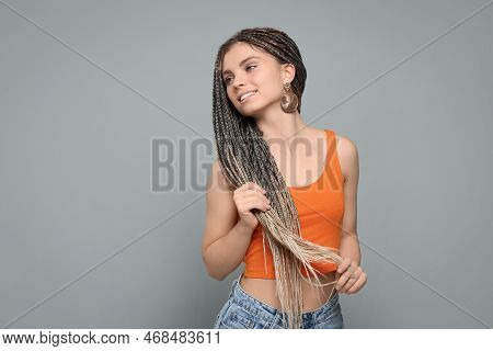 Beautiful Woman With Long African Braids On Grey Background, Space For Text