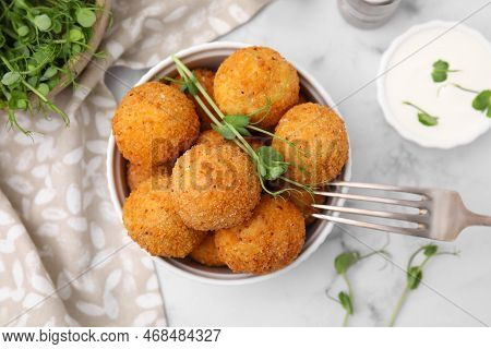 Bowl Of Delicious Fried Tofu Balls With Pea Sprouts And Sauce On White Marble Table, Flat Lay