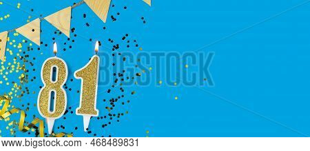 Golden Candle Number Eighty One. Birthday Or Anniversary Card With The Inscription 81 On Blue Backgr