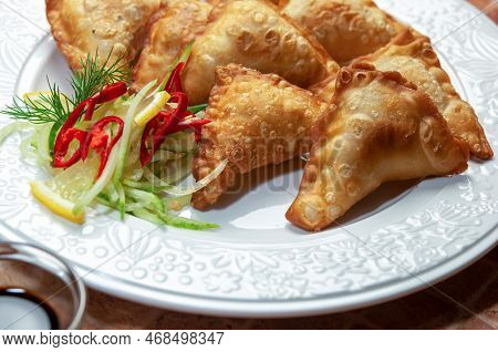 Asian Fried Dumplings With Soy And Sweet And Sour Sauce On White Dish. Fried Dumplings Gyoza With So